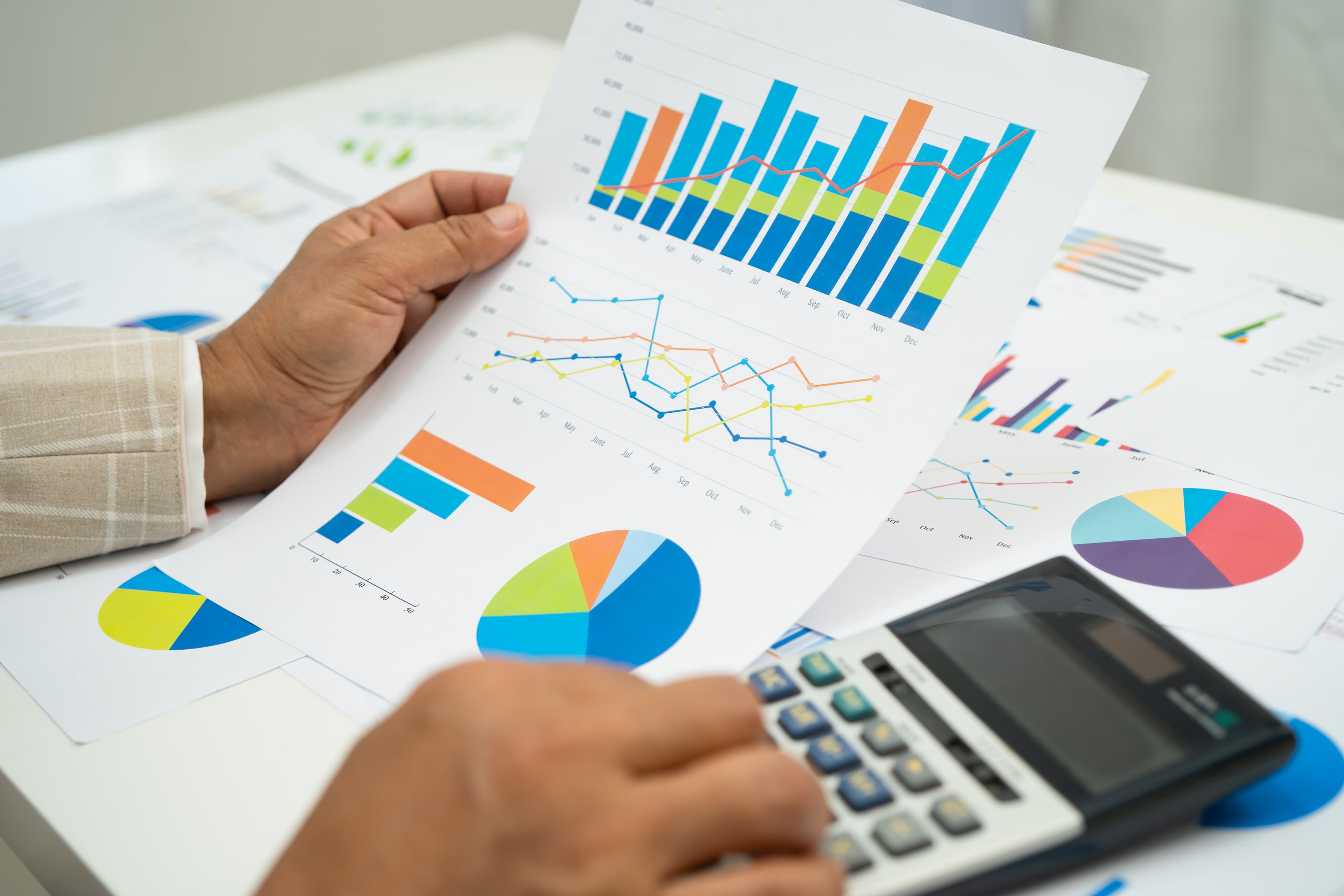 Business woman analyzing financial graphs