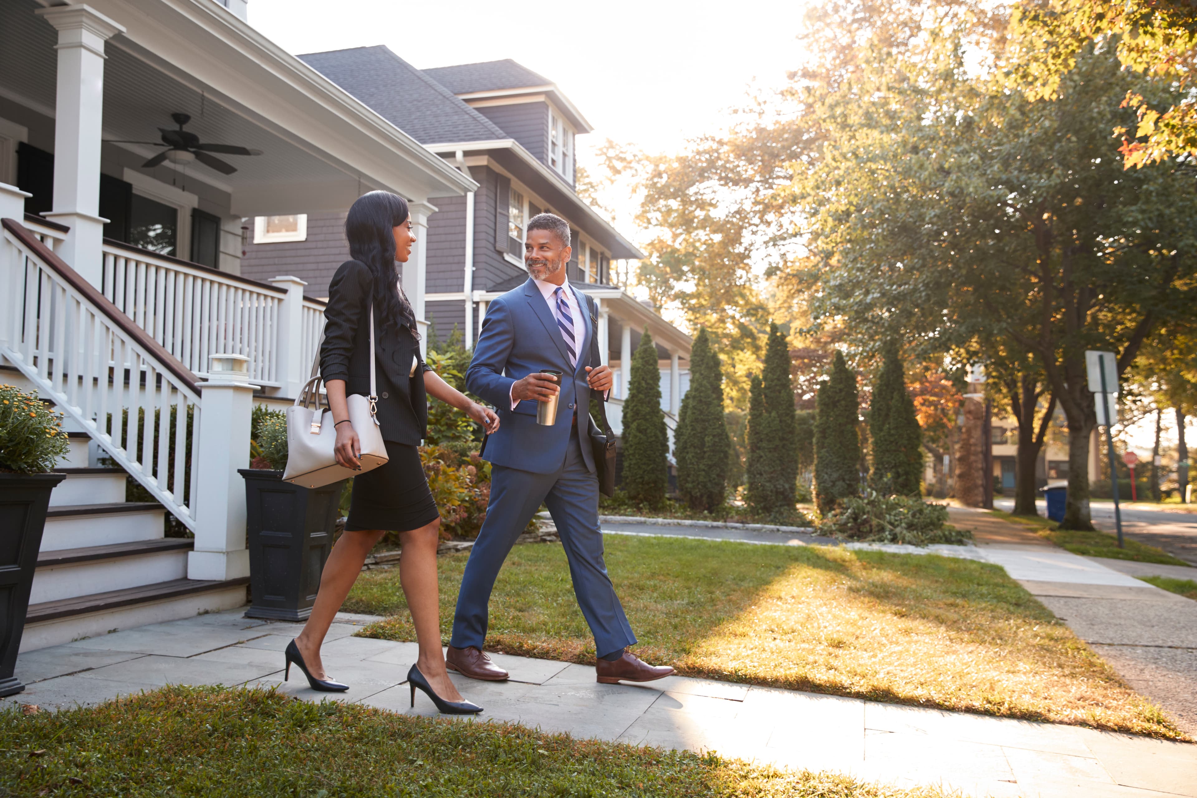 Couple commuting from suburban home