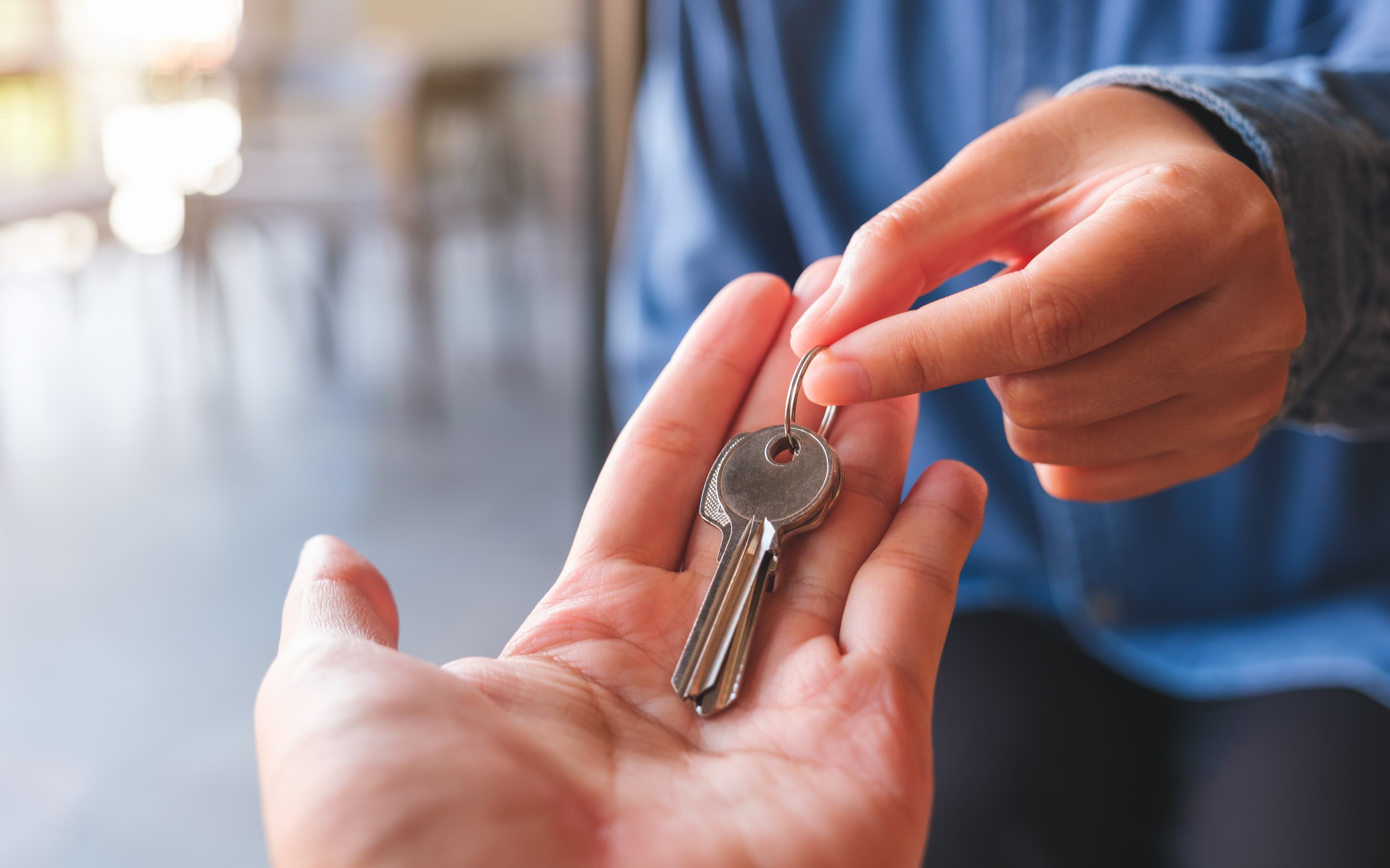 Real estate agent handing over keys