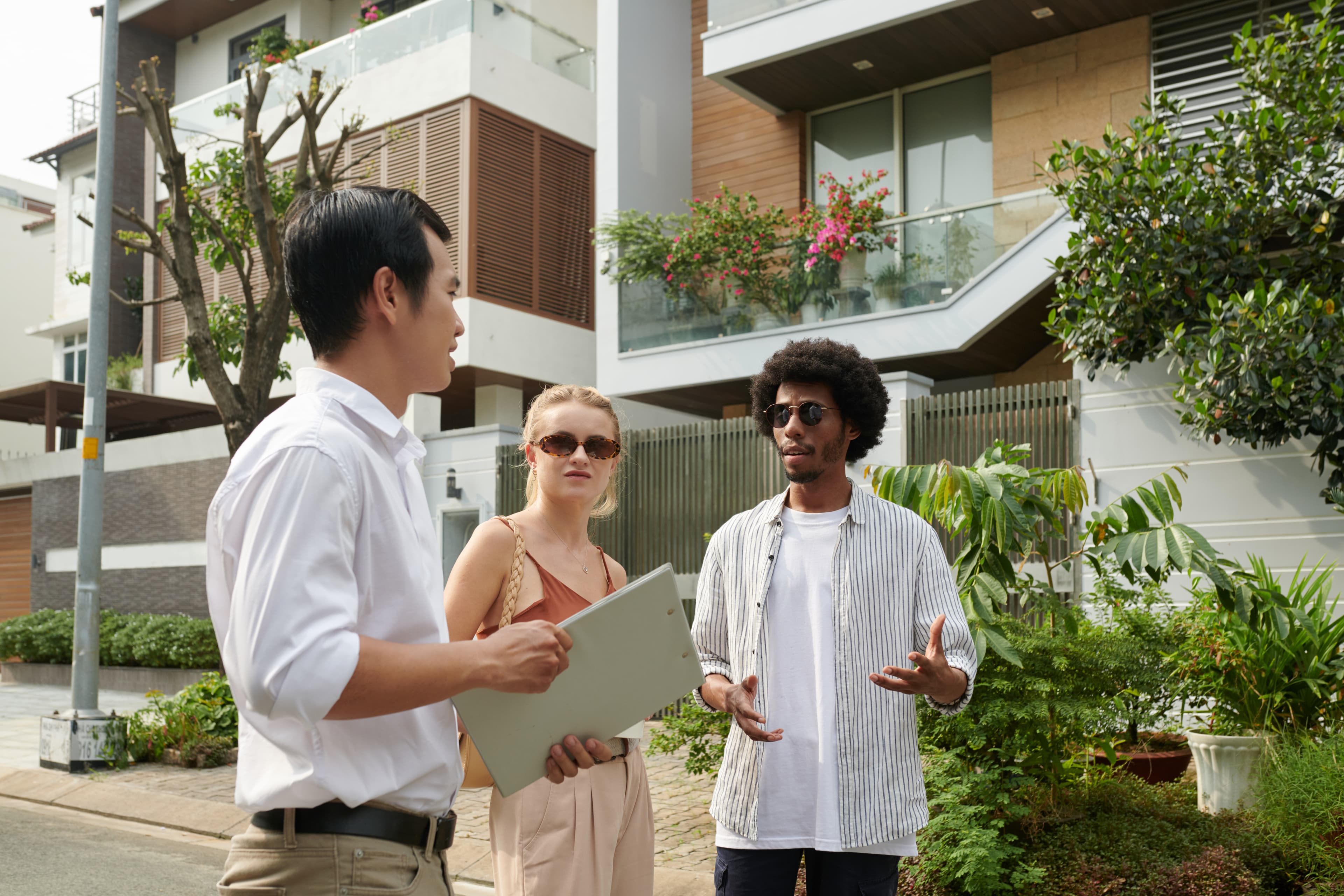 Estate agent meeting with young couple