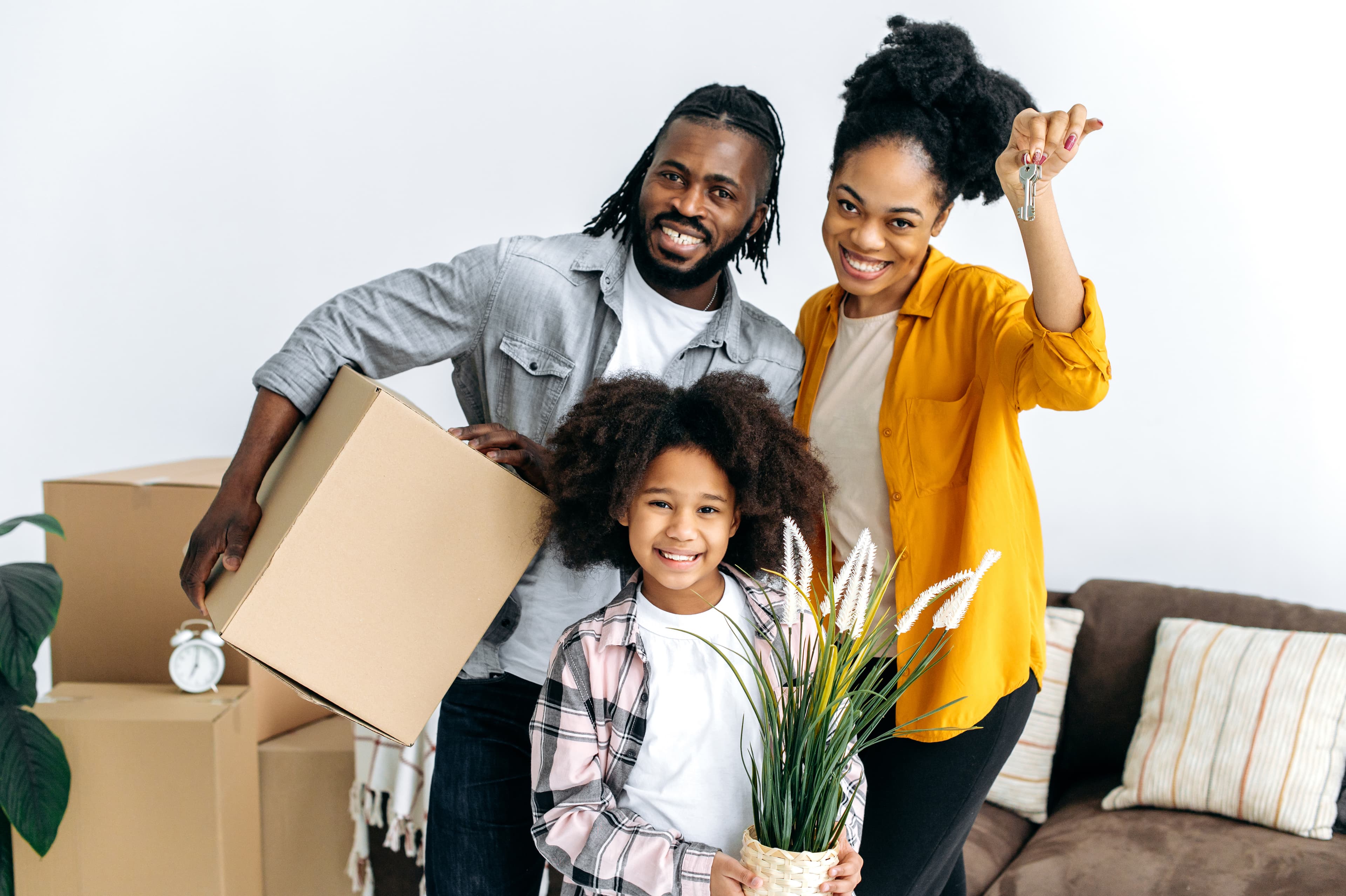 Happy family moving into their new rental home
